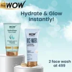 Two WOW face wash tubes on white pedestals with promotional text against a blue bokeh background