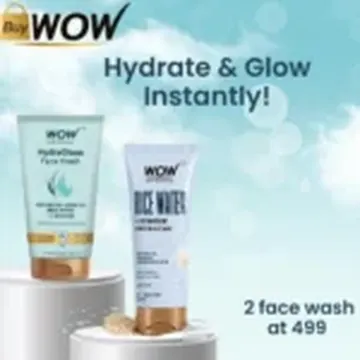 Two WOW face wash tubes on white pedestals with promotional text against a blue bokeh background