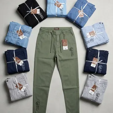 Eight folded color variants of men's trousers arranged around a central olive green pair with tags