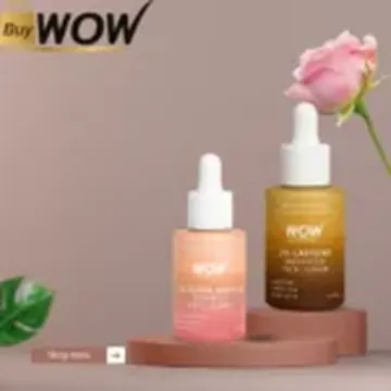 Two skincare serum bottles with droppers beside a pink rose and green leaf on terracotta pedestals