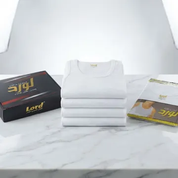 Stack of white undershirts and branded packaging on marble surface