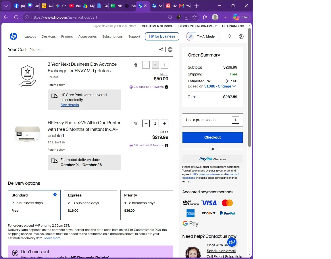 HP online shopping cart with two printer items and checkout options on a web browser