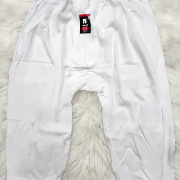 White men's boxer briefs with brand tags on fluffy white fur background