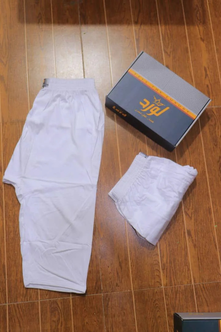 White underwear and a branded box on a wooden floor