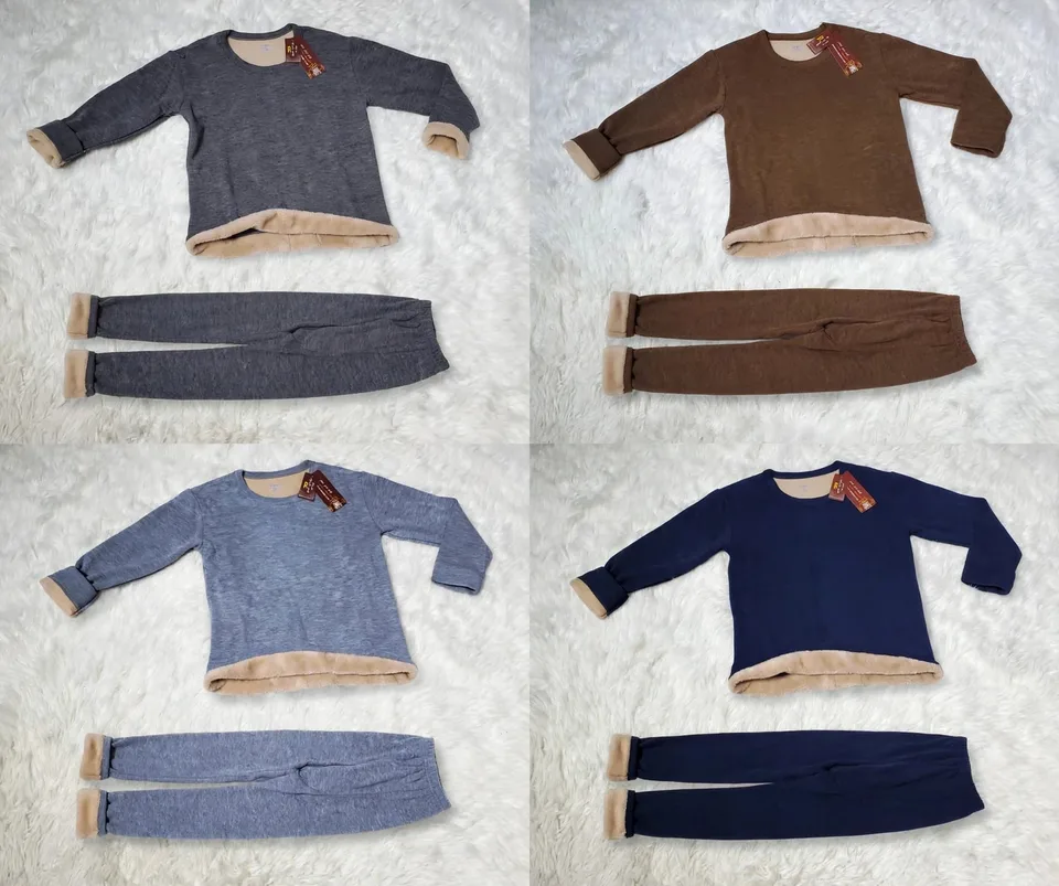 Four fleece-lined pajama sets in gray brown blue and navy on a fluffy white rug
