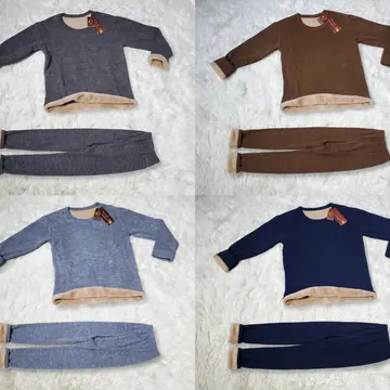 Four fleece-lined pajama sets in gray brown blue and navy on a fluffy white rug