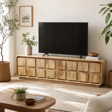 A modern living room with wooden furniture, plants, and sunlight streaming through windows